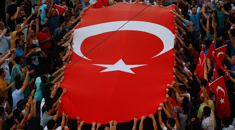 People gather at a pro-government rally in Istanbul's Taksim Square