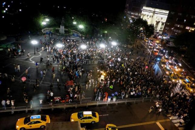 People take part in a protest against police brutality and in support of Black Lives Matter during a march in New York