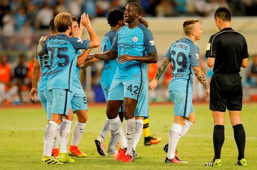 Manchester City celebrate after Sergio Aguero scores the first goal during the 2016 International Champions Cup against Borussia Dortmund at Shenzhen Universiade Stadium