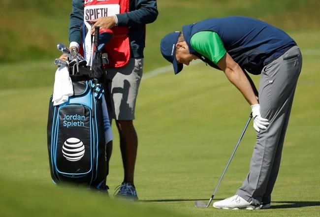 Jordan Spieth of the United States reacts after playing his shot on the 9th fairway fairway during the first round of the British Open Golf Championship at the Royal Troon Golf Club in Troon Scotland Thursday