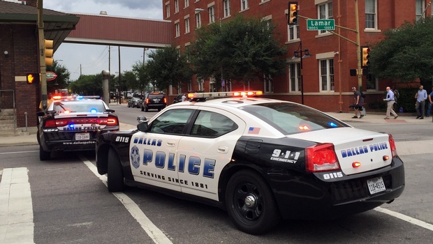 Police shut down the street in front of Dallas Police headquarters in an apparent lockdown as part of heightened security measures