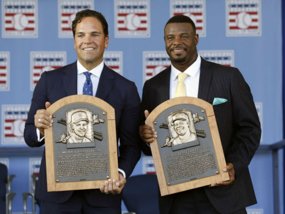 National Baseball Hall of Fame inductees Mike Piazza left and Ken Griffey Jr. hold their plaques after an induction ceremony on Sunday in Cooperstown N.Y