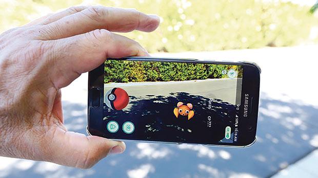 The augmented reality mobile game Pokémon Go by Nintendo on a smartphone screen