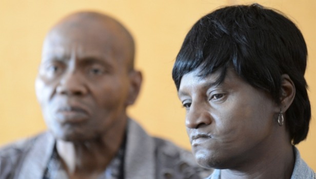 Gloria Darden mother of the late Freddie Gray stands silently with Gray's step-father Richard Shipley during a press