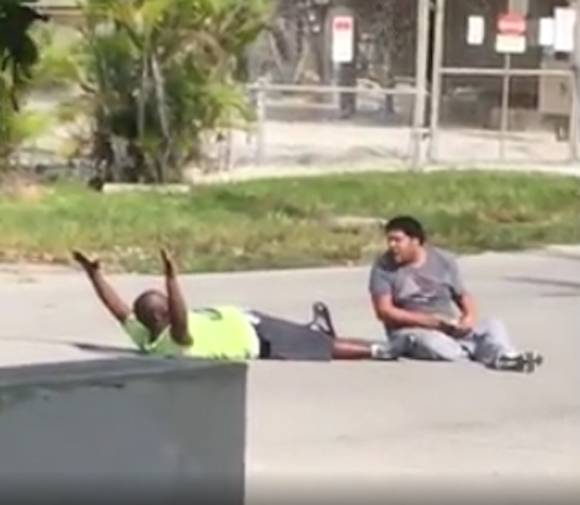 Black Man Shot by Police While Lying on the Ground With His Hands Up