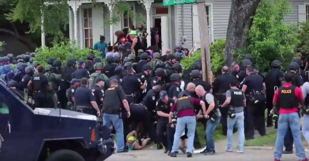 Police and protestors Sunday in Baton Rouge