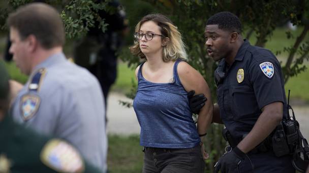 Police arrest protesters after dispersing crowds in a residential neighbourhood in Baton Rouge