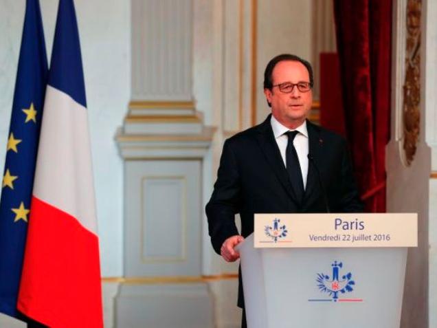 France's President Francois Hollande delivers a statement at the Elysee Palace on Friday