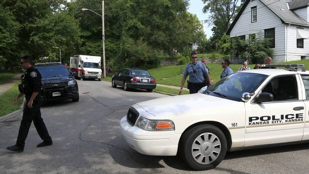 Police at the scene where an officer was shot dead in Kansas City