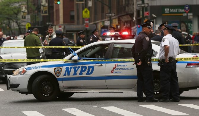 Police gather a crime scene in midtown Manhattan New York City