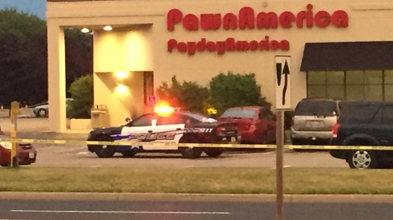 Police investigate incident at the Pawn America store in Grand Chute on Saturday