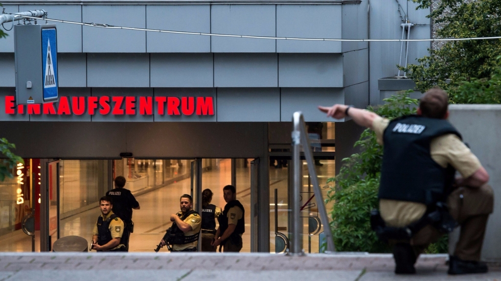 Police officers respond to a shooting at the Olympia Einkaufzentrum