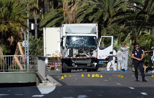 Police secure the area where a truck drove into a crowd during Bastille Day celebrations in Nice France 15 July 2016