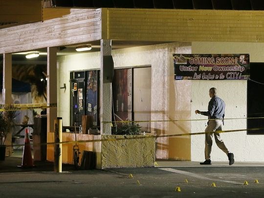 Police work the scene of a fatal shooting Monday at Club Blu in Fort Myers