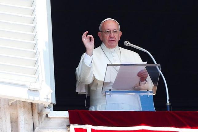 Pope Francis gestures during his Sunday Angelus prayer in Saint Peter's square at the Vatican