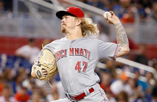 Cincinnati Reds&#39 John Lamb delivers a pitch during the first inning of a baseball game against the Miami Marlins Saturday