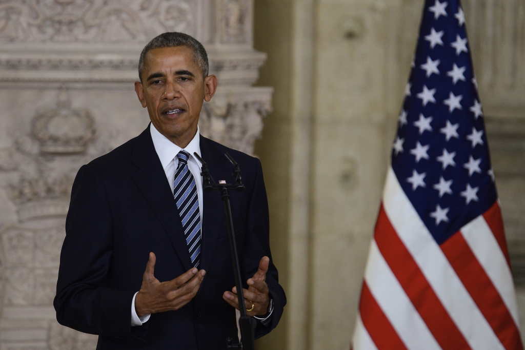 President Barack Obama give a thumbs-up as he walks across the South Lawn of the White House in Washington Tuesday