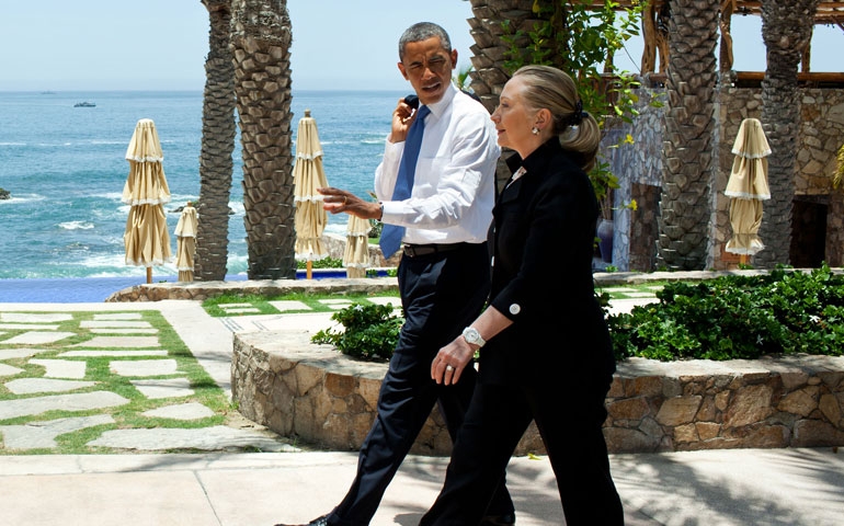 President Barack Obama walks with Secretary of State Hillary Clinton in Mexico in 2012