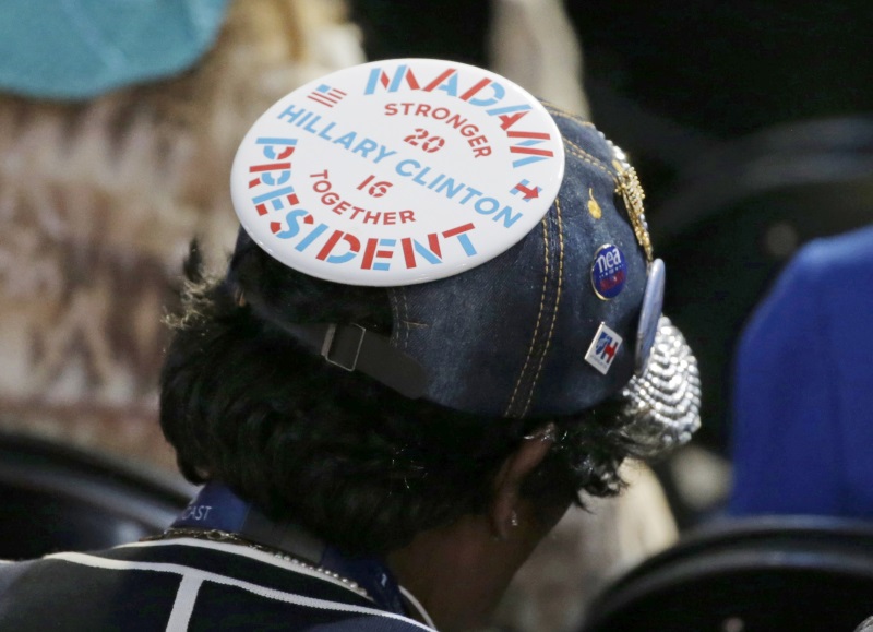 A delegate wears a Hillary Clinton button on their hat at the Democratic National Convention in Philadelphia