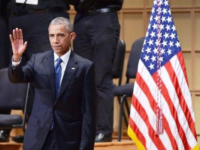 US President Barack Obama waves as he departs following an interfaith memorial service for the victims of the Dallas police shooting at the Morton H. Meyerson Symphony Center in Dallas on Tuesday