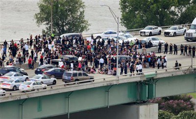 Black Lives Matter protesters gather on July 10 on the Hernando Desoto Bridge in Memphis Tenn. Protesters angry over police killings of black people occupied the key bridge over the Mississippi River blocking an interstate highway for hours. Commercial