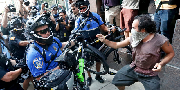 Protesters clash with police in Cleveland during the second day of the Republican convention