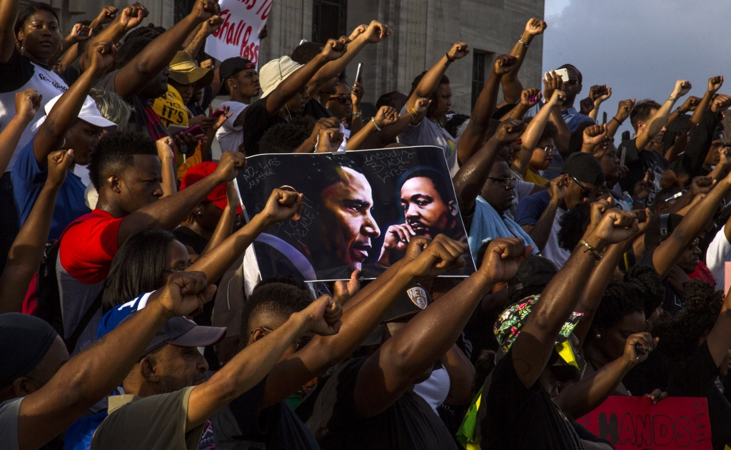 Protesters gather at the Louisiana Capitol to protest the shooting of Alton Sterling