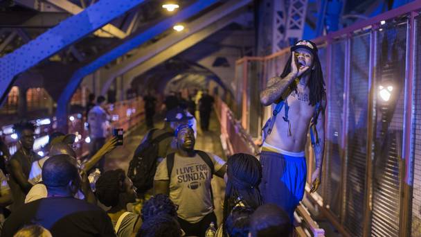 Protesters march across Williamsburg bridge in New York following the police shootings in Louisiana and Minnesota