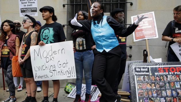 Protesters rally outside a court hearing for an officer charged in the death of Freddie Gray in Baltimore in June. Patrick Semansky  AP