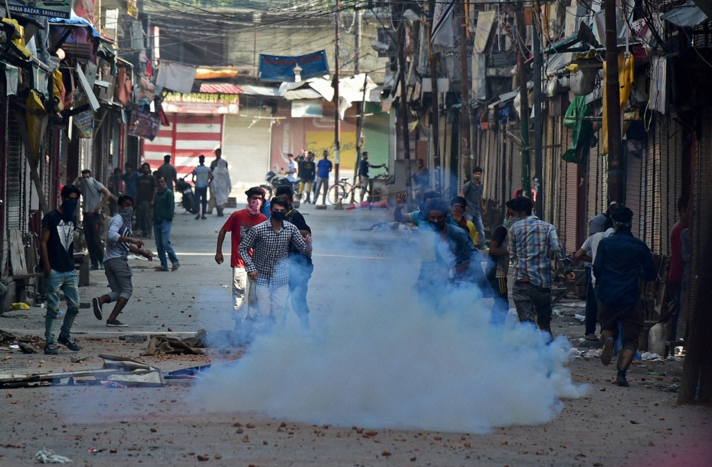 Protesters throw stones on the police during clashes in Srinagar. Credit PTI  S Irfan