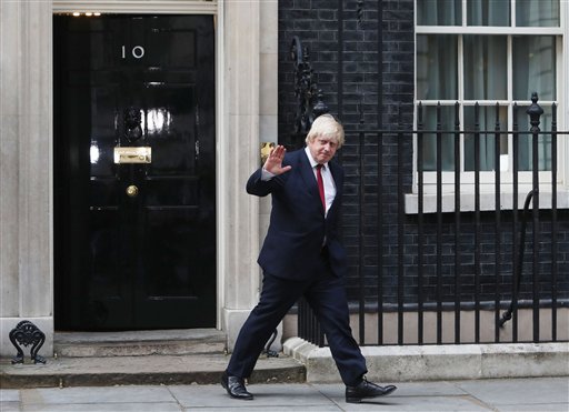 Boris Johnson leaves 10 Downing Street after being appointed Foreign Secretary following a Cabinet reshuffle by new Prime Minister Theresa May in London Wednesday