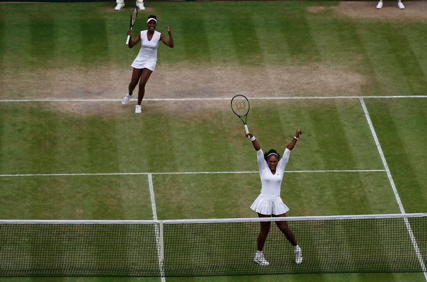 REUTERS
Serena and Venus celebrate winning the final