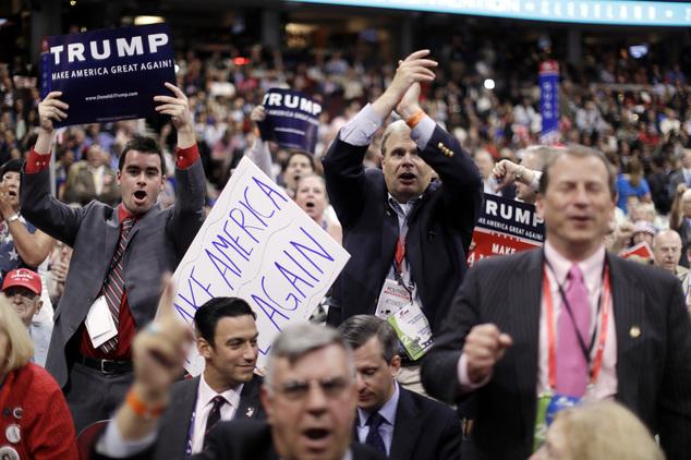 New Jersey delegates cheer as New Jersey Gov. Chris Christie speaks during the second day session of the Republican National Convention in Cleveland Tuesday