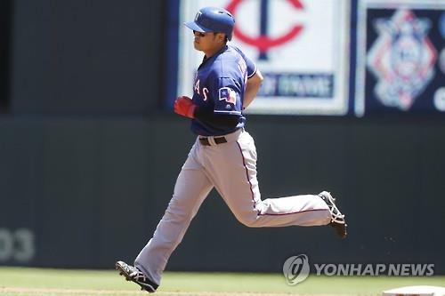 3 2016 Choo Shin-soo of the Texas Rangers rounds the bases after hitting a solo home run against the Minnesota Twins at Target Field in Minneapolis Minnesota