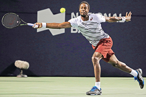 TORONTO ON- JULY 29 Gael Monfils of France plays a shot against Milos Raonic of Canada during Day 5 of the Rogers Cup at the Aviva Centre