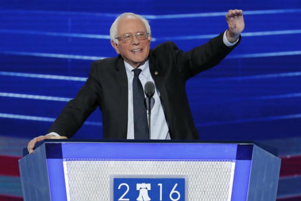 Former Democratic presidential candidate Sen. Bernie Sanders I-Vt. waves to delegates before speaking during the first day of the Democratic National Convention in Philadelphia Pennsylvania