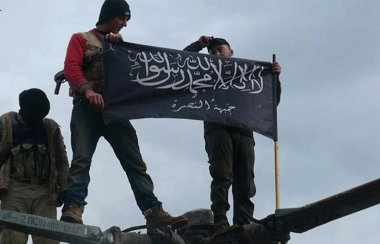 Rebels from Jabhat al Nusra waving their flag