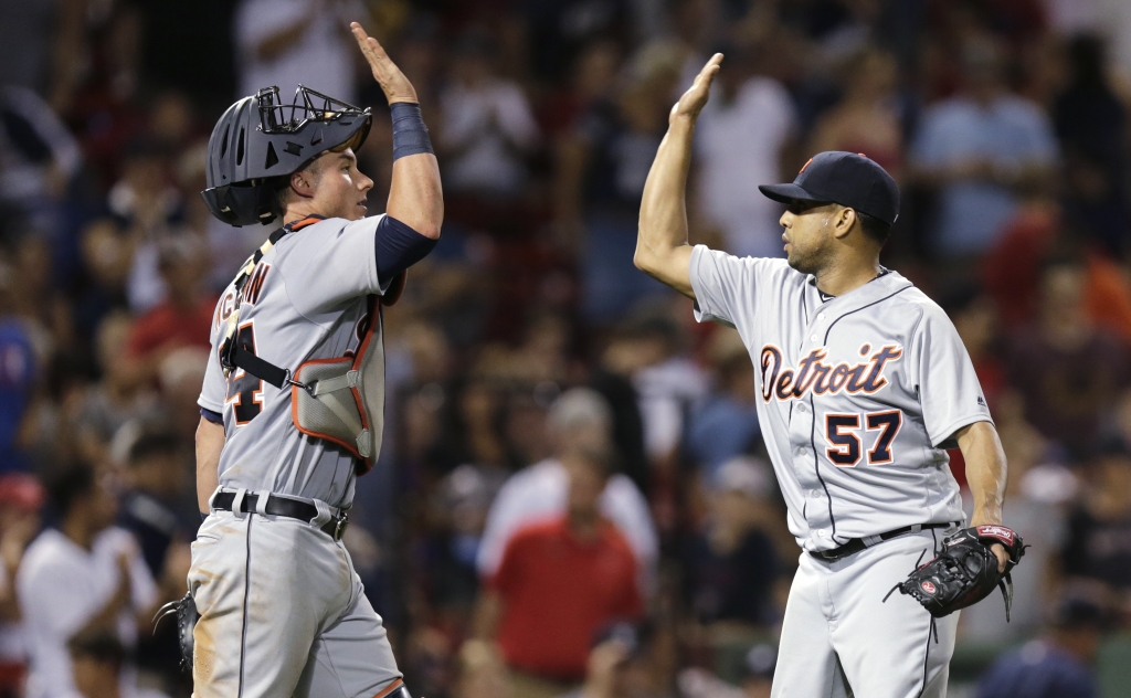 Detroit Tigers relief pitcher Francisco Rodriguez is congratulated by catcher James Mc Cann after earning a save after defeating the Boston Red Sox 4-2 during a baseball game at Fenway Park Monday