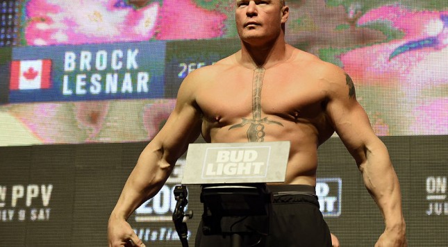 LAS VEGAS NV- JULY 08 Mixed martial artist Brock Lesnar poses on the scale during his weigh-in for UFC 200 at T Mobile Arena