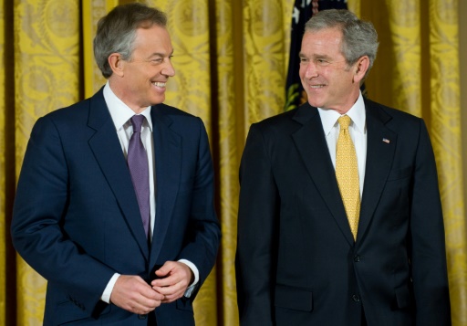 US President George W. Bush smiles alongside former British Prime Minister Tony Blair at the White House