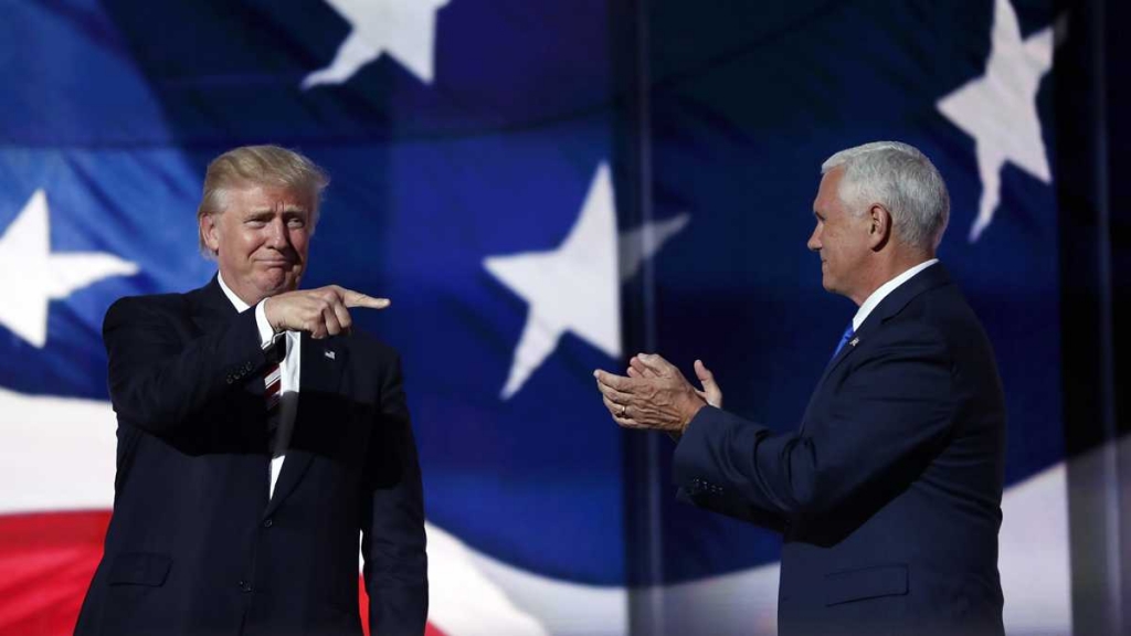 Republican Presidential Candidate Donald Trump points toward Republican Vice Presidential Nominee Gov. Mike Pence of Indiana after Pence's acceptance speech during the third day session of the Republican National Convention in Cleveland Wednesday July