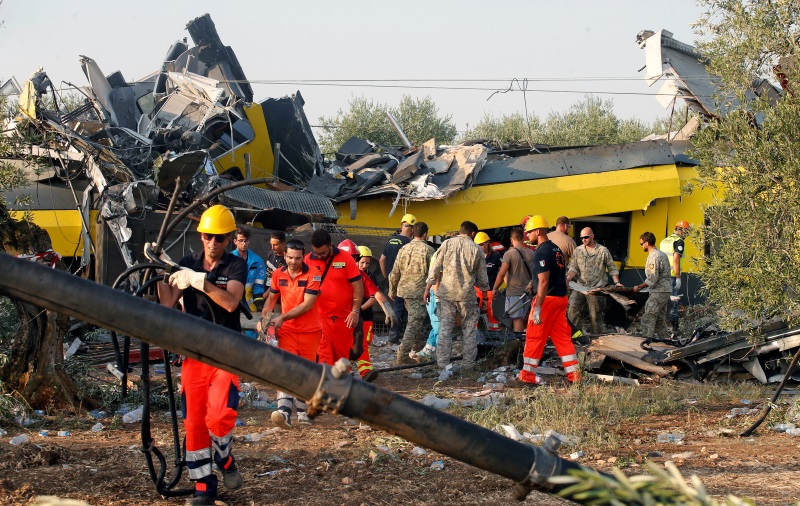 Rescuers work at the crash site