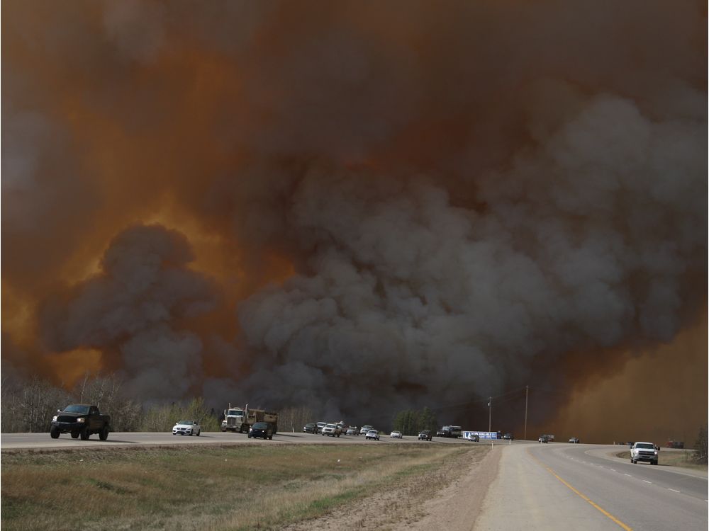 Residents of Fort Mc Murray flee southbound on Highway 63 after wildfires forced the evacuation of the city