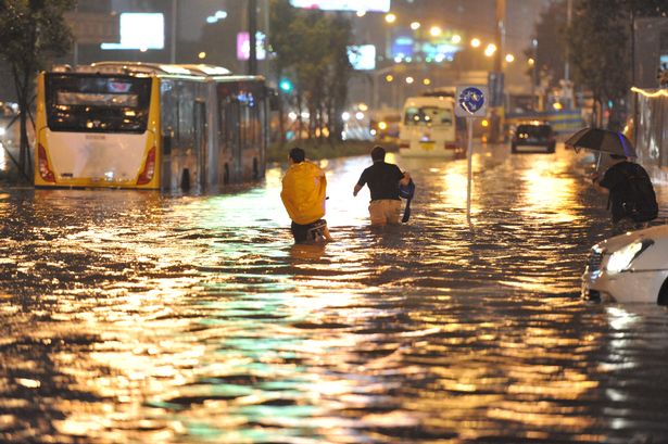 2016 Rex Features
Flooding Heavy rain in Beijing has caused flooding