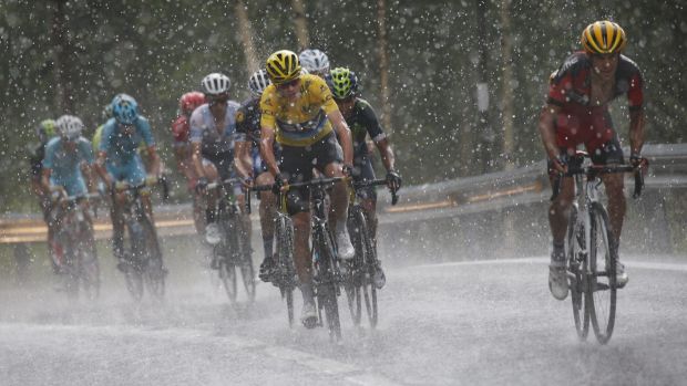 Richie Porte tries to gain time on Chris Froome and Nairo Quintana in the hail on the final climb. He was reeled back