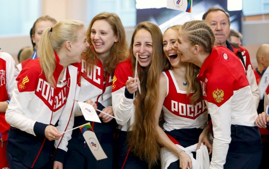 Putin slams discrimination as banned athletes join send-off