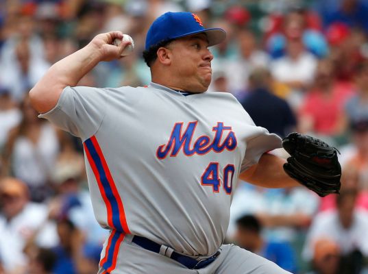 New York Mets starter Bartolo Colon throws against