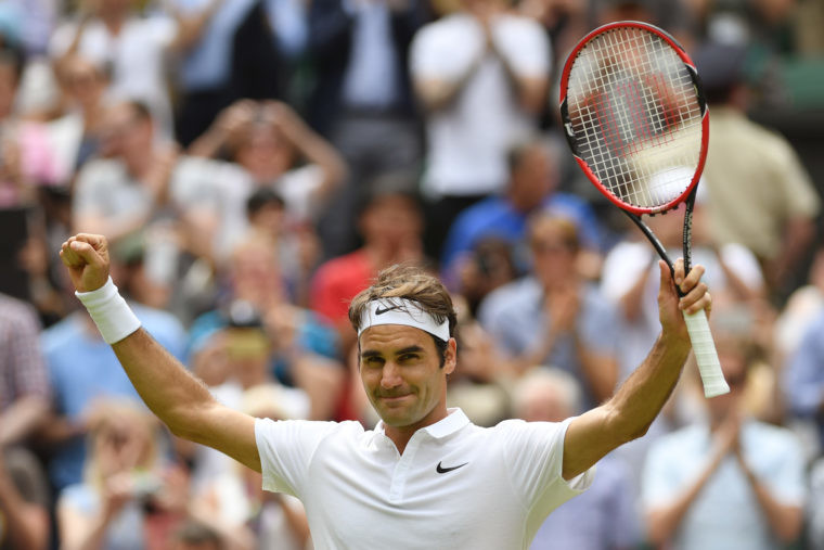 Roger Federer celebrates victory at Wimbledon