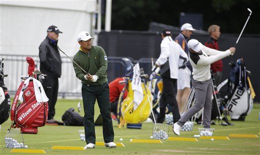 Lee Soomin of Korea watches his shot on the practice range ahead of the British Open Golf Championship at the Royal Troon Golf Club in Troon Scotland Tuesday