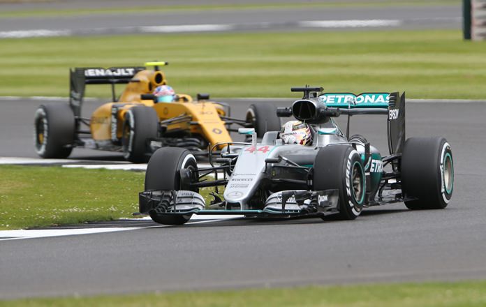 Mercedes driver Lewis Hamilton and Renault driver Jolyon Palmer both of Britain steer their cars during the first free practice session at the Silverstone race track Silverstone England on Friday July 8. The British Formula One Grand Prix will be